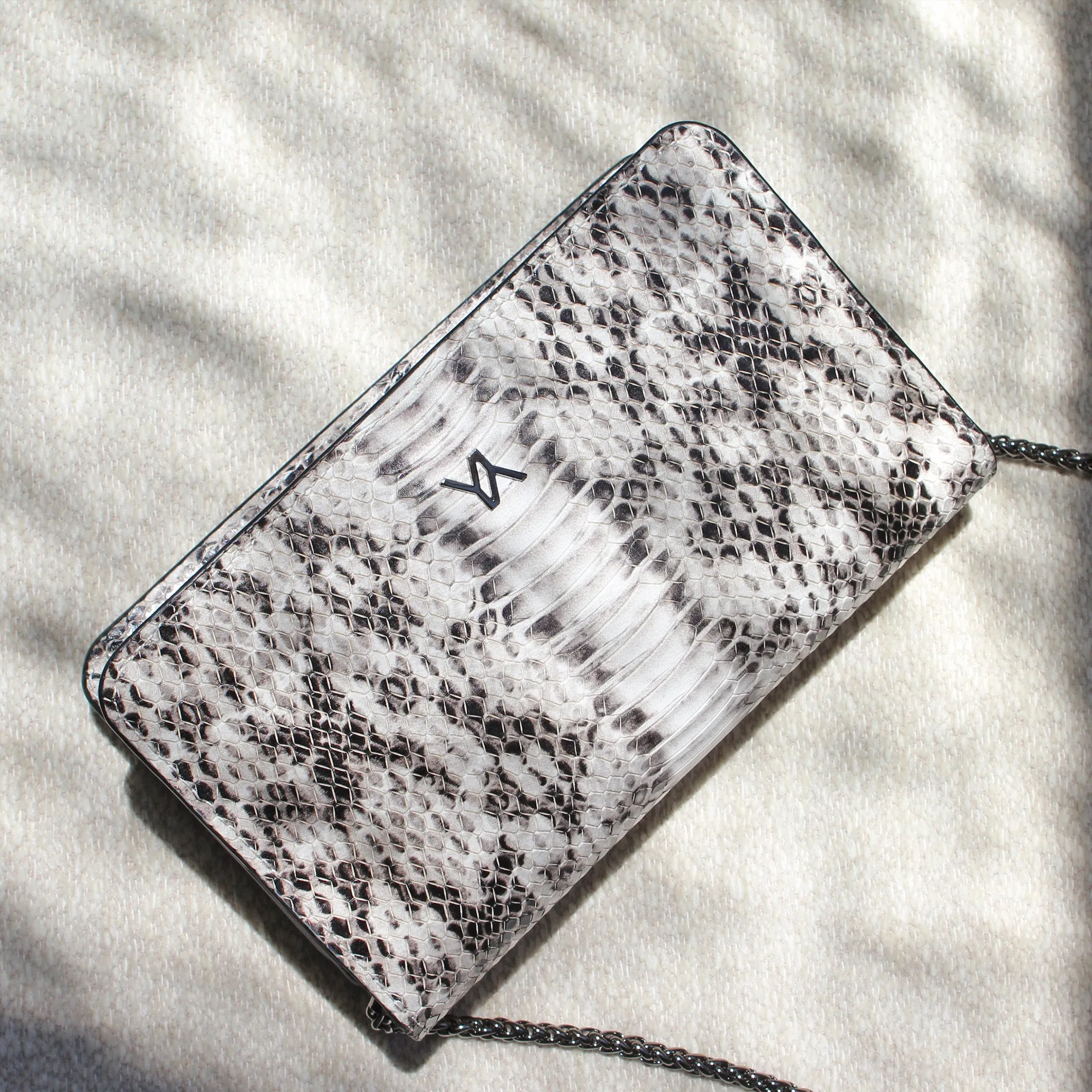Lea embossed python natural clutch