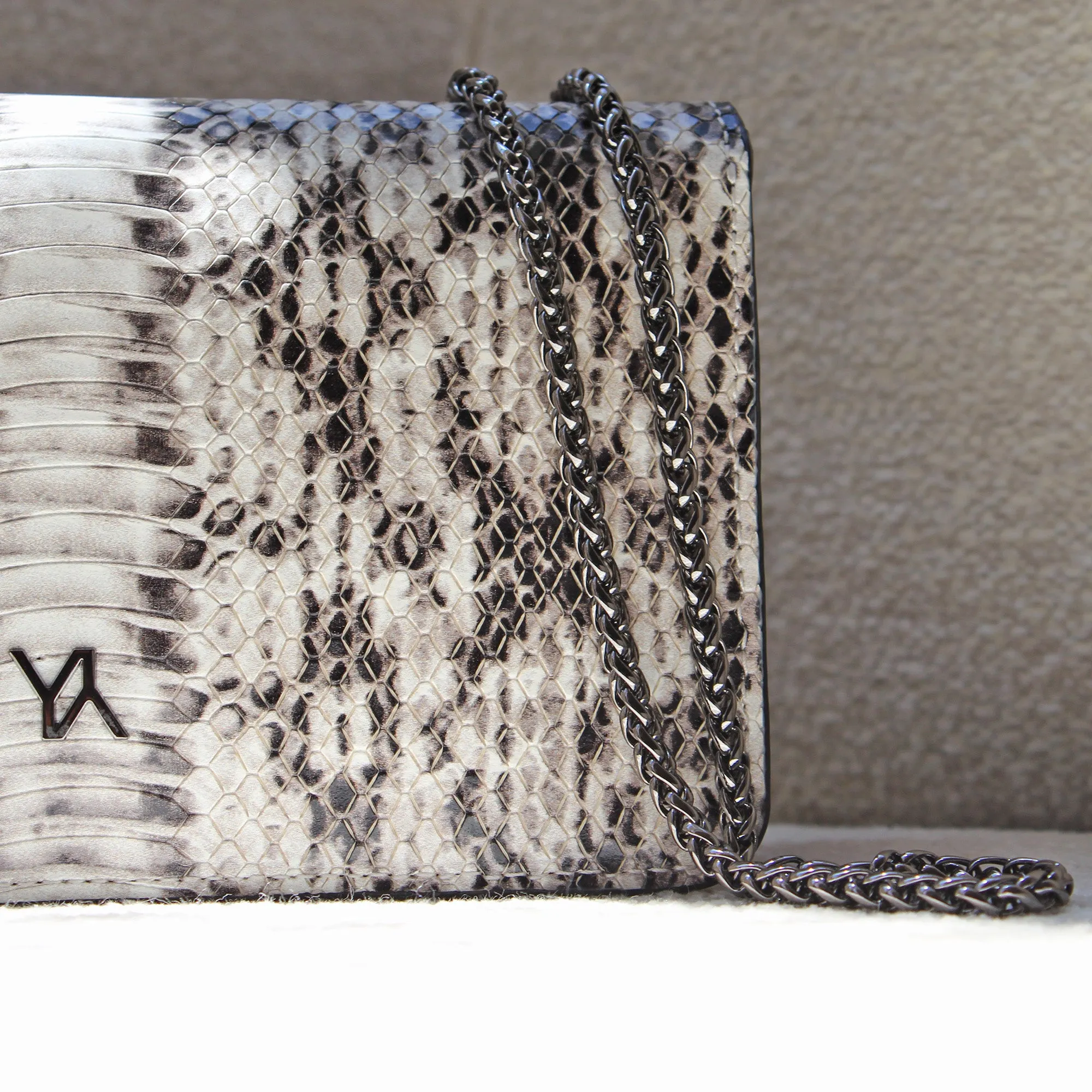 Lea embossed python natural clutch